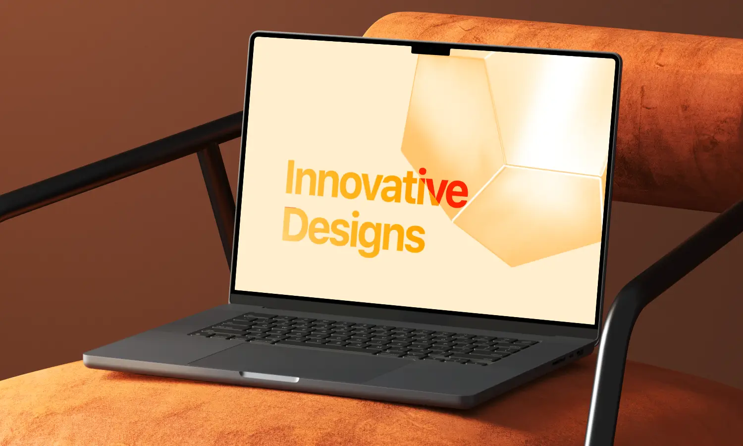 Laptop on an orange chair displaying the text 'Innovative Designs' on a beige screen.